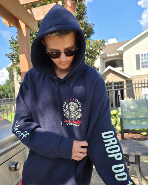Real OG hoodie sample: front portrait. Personalized sleeve names are not included; see product-design images for this release.